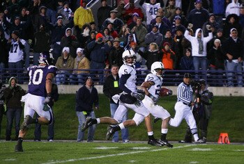 EVANSTON, IL - OCTOBER 31: Evan Royster #22 of the Penn State Nittany Lions runs 69 yards for a touchdown as teammate Graham Zug #5 and Brian Peters #10 of the Northwestern Wildcats follow at Ryan Field on October 31, 2009 in Evanston, Illinois. Penn Stat