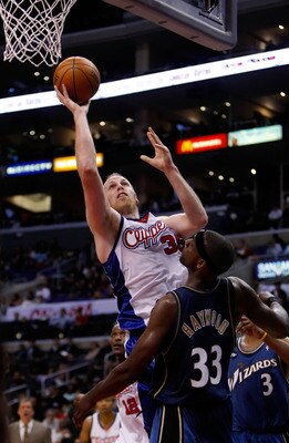 LOS ANGELES, CA - DECEMBER 14:  Chris Kaman #35 of the Los Angeles Clippers drives to the basket past Brendan Haywood #33 of the Washington Wizards in the second half at Staples Center on December 14, 2009 in Los Angeles, California. The Clippers defeated