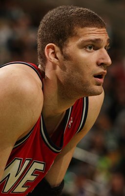 BOSTON - FEBRUARY 27:  Brook Lopez #11 of the New Jersey Nets looks on during a free throw in the second half against the Boston Celtics at the TD Garden on February 27, 2010 in Boston, Massachusetts. The Nets defeated the Celtics 104-96.  NOTE TO USER: U