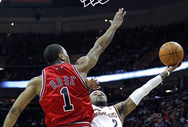 CLEVELAND - APRIL 27:  Mo Williams #2 of the Cleveland Cavaliers tries to get a shot off around Derrick Rose #1 of the Chicago Bulls in Game Five of the Eastern Conference Quarterfinals during the 2010 NBA Playoffs at Quicken Loans Arena on April 27, 2010