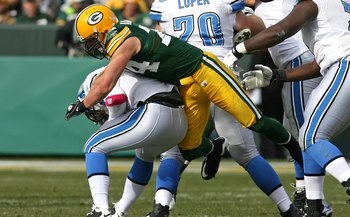 GREEN BAY, WI - OCTOBER 18: Aaron Kampman #74 of the Green Bay Packers sacks Duante Culpepper #11 of the Detroit Lions at Lambeau Field on October 18, 2009 in Green Bay, Wisconsin. The Packers defeated the Lions 26-0. (Photo by Jonathan Daniel/Getty Image