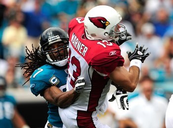 JACKSONVILLE, FL - SEPTEMBER 20:  Kurt Warner #13 of the Arizona Cardinals is tackled by Rashean Mathis #27 of the Jacksonville Jaguars during the game at Jacksonville Municipal Stadium on September 20, 2009 in Jacksonville, Florida.  (Photo by Sam Greenw