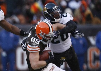 CLEVELAND - JANUARY 03:  Evan Moore #89 of the Cleveland Browns dives for yardage as he is hit by Daryl Smith #52 and Anthony Smith #20 of the Jacksonville Jaguars at Cleveland Browns Stadium on January 3, 2010 in Cleveland, Ohio.  (Photo by Matt Sullivan