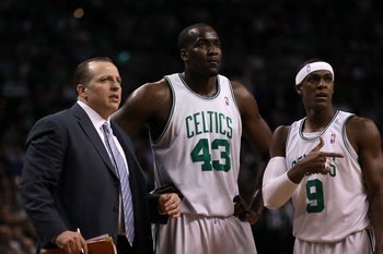 BOSTON - MAY 28:  (L-R) Assistant coach Tom Thibodeau, Kendrick Perkins #43 and Rajon Rondo #9 of the Boston Celtics look on against the Orlando Magic in Game Six of the Eastern Conference Finals during the 2010 NBA Playoffs at TD Garden on May 28, 2010 i