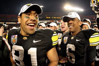 MIAMI GARDENS, FL - JANUARY 05:  (L-R) Tony Moeaki #81 and Keenan Davis #6 of the Iowa Hawkeyes celebrate after Iowa won 24-14 against the Georgia Tech Yellow Jackets during the FedEx Orange Bowl at Land Shark Stadium on January 5, 2010 in Miami Gardens, 