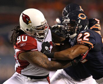 CHICAGO - AUGUST 28: Darnell Dockett #90 of the Arizona Cardinals rushes against Matt Forte #22 of the Chicago Bears during a preseason game at Soldier Field on August 28, 2010 in Chicago, Illinois. The Cardinals defeated the Bears 14-9. (Photo by Jonatha