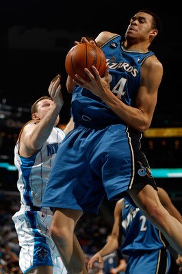 NEW ORLEANS - MARCH 31:  JaVale McGee #34 of the Washington Wizards grabs a rebound over Darius Songaila #9 of the New Orleans Hornets at New Orleans Arena on March 31, 2010 in New Orleans, Louisiana.  NOTE TO USER: User expressly acknowledges and agrees 