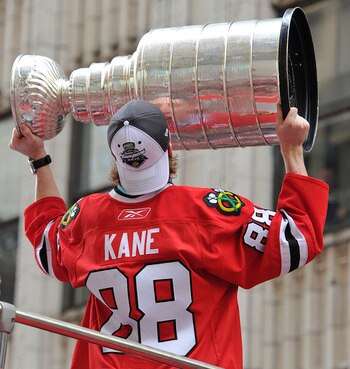 CHICAGO - JUNE 11:  Patrick Kane of the Chicago Blackhawks kisses the Stanley Cup during the team's victory parade on June 11, 2010 in Chicago, Illinois. (Photo by Jim Prisching/Getty Images)