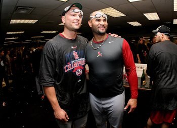 DENVER - SEPTEMBER 26:  (L-R) Matt Holliday and Albert Pujols of the St. Louis Cardinals celebrate clinching the National League Central Division after defeating the Colorado Rockies at Coors Field on September 26, 2009 in Denver, Colorado. The Cardinals