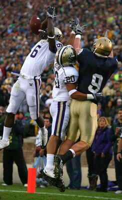 SOUTH BEND, IN - OCTOBER 03: Desmond Trufant #6 of the Washington Huskies breaks up a pass intended for Kyle Rudolph #9 of the Notre Dame Fighting Irish as teammate Justin Glenn #20 also defends on October 3, 2009 at Notre Dame Stadium in South Bend, Indi