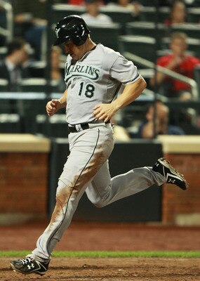 NEW YORK - AUGUST 25:  Wes Helms #18 of the Florida Marlins scores a run off of a double hit by Brett Hayes #9 (not shown) in the sixth inning against the New York Mets on August 25, 2010 at Citi Field in the Flushing neighborhood of the Queens borough of