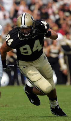 WEST LAFAYETTE, IN - SEPTEMBER 20:  Quarterback Dan LeFevour #13 of the Central Michigan Chippewas runs the ball past Ryan Kerrigan #94 of the Purdue Boilermakers at Ross-Ade Stadium on September 20, 2008 in West Lafayette, Indiana.  (Photo by Ronald Mart