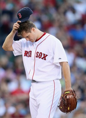 BOSTON - SEPTEMBER 05: Jonathan Papelbon #58 of the Boston Red Sox heads for the dugout after he is pulled in the ninth inning against the Chicago White Sox on September 5, 2010 at Fenway Park in Boston, Massachusetts.  (Photo by Elsa/Getty Images)
