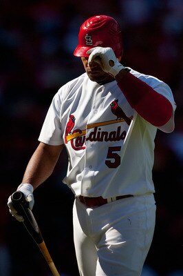 ST. LOUIS - SEPTEMBER 5: Albert Pujols #5 of the St. Louis Cardinals returns to the dugout after striking out against the Cincinnati Reds at Busch Stadium on September 5, 2010 in St. Louis, Missouri.  The Cardinals beat the Reds 4-2.  (Photo by Dilip Vish