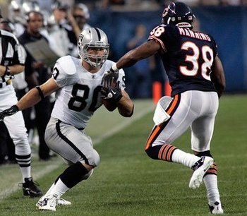 Miller makes a move on Daniel Manning of the bears.