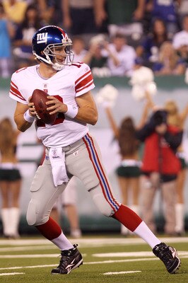 EAST RUTHERFORD, NJ - AUGUST 16:  Eli Manning #10 of the New York Giants drops back to pass in the first quarter during their game against the New York Jets at New Meadowlands Stadium on August 16, 2010 in East Rutherford, New Jersey.  (Photo by Nick Laha