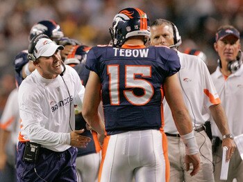 DENVER - AUGUST 29: Head coach Josh McDaniels of the Denver Broncos congratulates quarterback Tim Tebow #15 following his fourth quarter touchdown pass against the Pittsburgh Steelers at INVESCO Field at Mile High on August 29, 2010 in Denver, Colorado.  