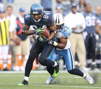 SEATTLE - AUGUST 14:  Wide receiver T.J. Houshmandzadeh #84 of the Seattle Seahawks makes a catch against Ryan Mouton #29 during the preseason game against the Tennessee Titans at Qwest Field on August 14, 2010 in Seattle, Washington. (Photo by Otto Greul