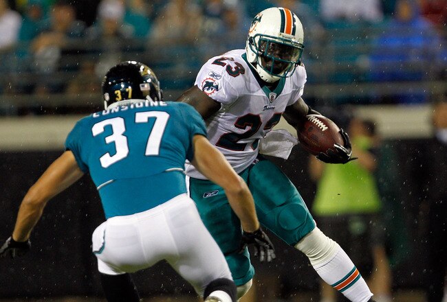 JACKSONVILLE, FL - AUGUST 21:  Ronnie Brown #23 of the Miami Dolphins attempts to run past Sean Considine #37 of the Jacksonville Jaguars during the preseason game at EverBank Field on August 21, 2010 in Jacksonville, Florida.  (Photo by Sam Greenwood/Get