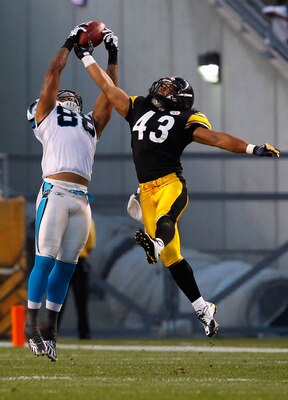 PITTSBURGH - SEPTEMBER 02:  Dante Rosario #88 of the Carolina Panthers catches a pass in front of Troy Polamalu #43 of the Pittsburgh Steelers during the preseason game on September 2, 2010 at Heinz Field in Pittsburgh, Pennsylvania.  (Photo by Jared Wick