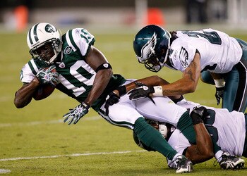 PHILADELPHIA - SEPTEMBER 02:  Trevard Lindley #35 and Macho Harris #24 of the Philadelphia Eagles take down Santonio Holmes #10 of the New York Jets in a preseason game at Lincoln Financial Field on September 2, 2010 in Philadelphia, Pennsylvania.  (Photo