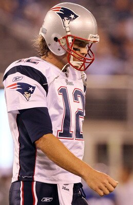 EAST RUTHERFORD, NJ - SEPTEMBER 02:  Tom Brady #12 of the New England Patriots walks to the sideline after throwing an interception against the New York Giants on September 2, 2010 at the New Meadowlands Stadium in East Rutherford, New Jersey.  (Photo by