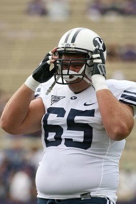 SEATTLE - SEPTEMBER 6:  Dallas Reynolds #65 of the BYU Cougars warms up prior to their game against the Washington Huskies on September 6, 2008 at Husky Stadium in Seattle, Washington. The Cougars defeated the Huskies 28-27. (Photo by Otto Greule Jr/Getty