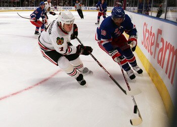 NEW YORK - OCTOBER 10:  Bre4nt Seabrook #7 of the Chicago Blackhawks defends against Nigel Dawes #10 of the New York Rangers on October 10, 2008 at Madison Square Garden in New York City.  (Photo by Jim McIsaac/Getty Images)