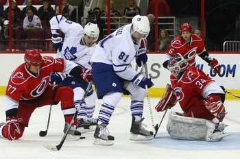 RALEIGH, NC - NOVEMBER 19:  Alexei Ponikarovsky #23 and Phil Kessel #81 of the Toronto Maple Leafs are stopped by Manny Legace #34 of the Carolina Hurricanes at the RBC Center on November 19, 2009 in Raleigh, North Carolina.  (Photo by Bruce Bennett/Getty