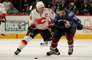 DENVER - OCTOBER 16:  Paul Stastny #26 of the Colorado Avalanche and Jarome Iginla #12 of the Calgary Flames pursue the puck during NHL action at the Pepsi Center on October 16, 2007.  (Photo by Doug Pensinger/Getty Images)