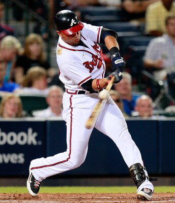 ATLANTA - AUGUST 31:  Martin Prado #14 of the Atlanta Braves hits a single to right field in the fifth inning against the New York Mets at Turner Field on August 31, 2010 in Atlanta, Georgia.  (Photo by Kevin C. Cox/Getty Images)
