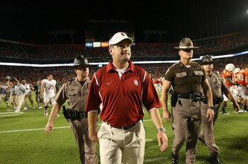 FORT LAUDERDALE, FL - OCTOBER 03: Head coach Bob Stoops of the Oklahoma Sooners walks off the field after his team lost to the Miami Hurricanes at Land Shark Stadium on October 3, 2009 in Fort Lauderdale, Florida. Miami defeated Oklahoma 21-20. (Photo by