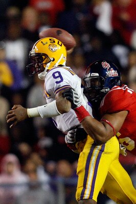 BATON ROUGE, LA - NOVEMBER 22:  Quarterback Jordan Jefferson #9 of the Louisiana State University Tigers is sacked by Lawon Scott #96 of the Ole Miss Rebels on November 22, 2008 at Tiger Stadium in Baton Rouge, Louisiana.  The Rebels defeated the Tigers 3