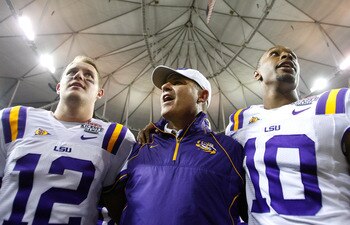 ATLANTA - SEPTEMBER 04:  Head coach Les Miles, Jarrett Lee #12 and Russell Shepard #10 of the LSU Tigers sing the LSU Alma Mater after their 30-24 win over the North Carolina Tar Heels in the Chick-fil-A Kickoff Game at Georgia Dome on September 4, 2010 i