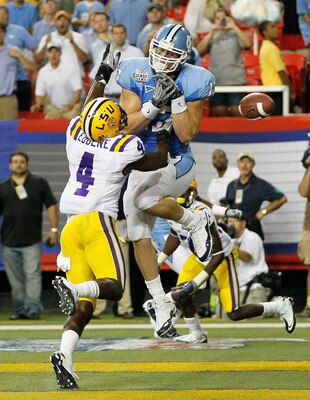 ATLANTA - SEPTEMBER 04:  Jai Eugene #4 of the LSU Tigers breaks up a touchdown reception intended for Zack Pianalto #17 of the North Carolina Tar Heels in the final seconds of the Chick-fil-A Kickoff Game at Georgia Dome on September 4, 2010 in Atlanta, G