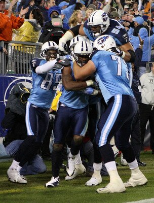 The Titans celebrate a long touchdown by Kenny Britt.