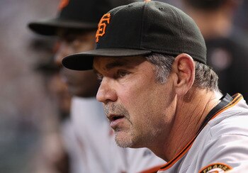 PHOENIX - SEPTEMBER 06:  Manager Bruce Bochy of the San Francisco Giants watches from dugout during the Major League Baseball game against the Arizona Diamondbacks at Chase Field on September 6, 2010 in Phoenix, Arizona.  The Giants defeated the Diamondba