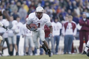 SEATTLE - NOVEMBER 19:  Running back Jerome Harrison #1 of the Washington State Cougars carries the ball against the Washington Huskies at Husky Stadium on November 19, 2005 in Seattle Washington. The Cougars defeated the Huskies 26-22.  (Photo by Otto Gr