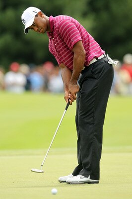 NORTON, MA - SEPTEMBER 03:  Tiger Woods putts on the 10th green during the first round of the Deutsche Bank Championship at TPC Boston on September 3, 2010 in Norton, Massachusetts.  (Photo by Mike Ehrmann/Getty Images)