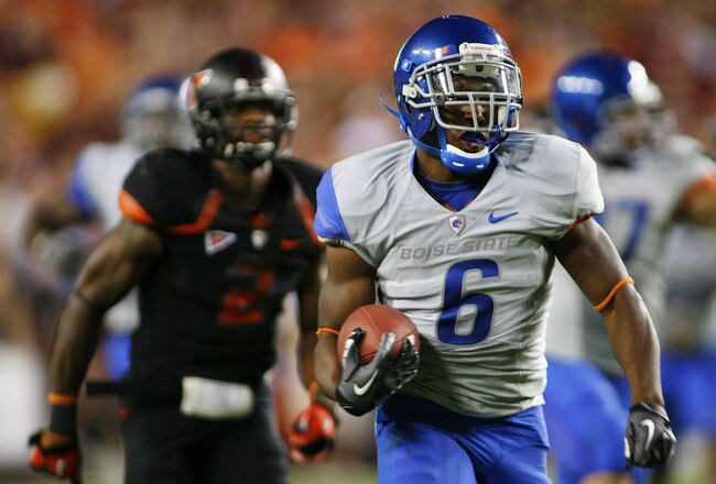 LANDOVER, MD - SEPTEMBER 06:  Running back #6 D.J. Harper of the Boise State Broncos runs for a touchdown as  safety #2 Davon Morgan of the Virginia Tech Hokies chases at FedExField on September 6, 2010 in Landover, Maryland.  (Photo by Geoff Burke/Getty