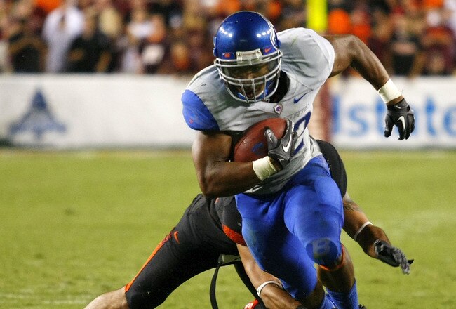 LANDOVER, MD - SEPTEMBER 06:  Running back #22 Doug Martin of the Boise State Broncos runs past linebacker #43 Jeron Gouveia-Winslow of the Virginia Tech Hokies at FedExField on September 6, 2010 in Landover, Maryland.  (Photo by Geoff Burke/Getty Images)