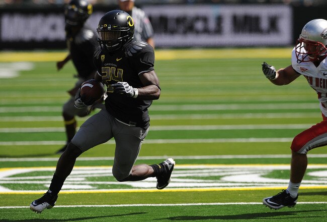 EUGENE, OR - SEPTEMBER 04: Running back Kenjon Barner #24 of the Oregon Ducks turns the corner on safety Bubba Forrest #28 of the New Mexico Lobos and scores a touchdown in the first quarter of the game at Autzen Stadium on September 4, 2010 in Eugene, Or