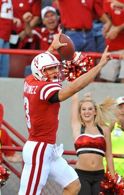 LINCOLN, NE - SEPTEMBER 04:  Taylor Matinez  #3 of the Nebraska Cornhuskers scores his first touchdown as a Cornhusker during the first half of  their game against the Western Kentucky Hilltoppers at Memorial Stadium on September 4, 2010 in Lincoln, Nebra