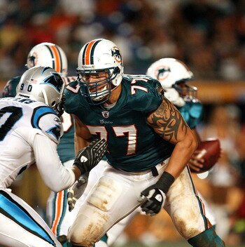 MIAMI - AUGUST 22:  Offensive lineman Jake Long #77 of the Miami Dolphins drops back to block against the Carolina Panthers during a pre-season game at Land Shark Stadium on August 22, 2009 in Miami, Florida. The Dolphins defeated the Panthers 27-17.  (Ph