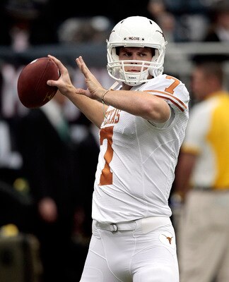 HOUSTON - SEPTEMBER 04:  Quarterback Garrett Gilbert #7 of the Texas Lonhgorns throws passes during pre-game warmups before playing the Rice Owls at Reliant Stadium on September 4, 2010 in Houston, Texas. Texas beat Rice 34-17.  (Photo by Bob Levey/Getty