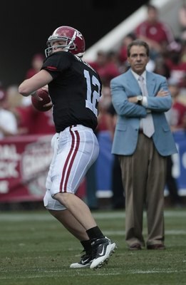 TUSCALOOSA, AL - APRIL 17:  Coach Nick Saban of the Alabama Crimson Tide watches quarterback Greg McElroy #12 throw during the Alabama spring game at Bryant Denny Stadium on April 17, 2010 in Tuscaloosa, Alabama. (Photo by Dave Martin/Getty Images)