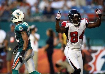 MIAMI - AUGUST 27:  Wide receiver Roddy White #84 (R) of the Atlanta Falcons celebrates a touchdown pass against cornerback Jason Allen #32 of the Miami Dolphins at Sun Life Stadium on August 27, 2010 in Miami, Florida.  (Photo by Marc Serota/Getty Images