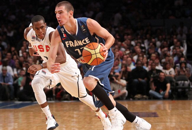 NEW YORK - AUGUST 15:  Nando De Colo #12 of France dribbles past Rajon Rondo #7 of the United States during their exhibition game as part of the World Basketball Festival at Madison Square Garden on August 15, 2010 in New York City.  (Photo by Nick Laham/