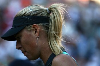NEW YORK - SEPTEMBER 06:  Maria Sharapova of Russia stands on the court during play against Caroline Wozniacki of Denmark during the women's singles match on day eight of the 2010 U.S. Open at the USTA Billie Jean King National Tennis Center on September
