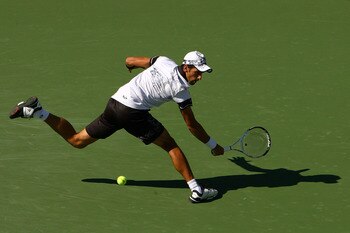 NEW YORK - SEPTEMBER 06:  Novak Djokovic of Serbia returns a shot against Mardy Fish of the United States during the men's singles match on day eight of the 2010 U.S. Open at the USTA Billie Jean King National Tennis Center on September 6, 2010 in the Flu